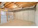 Unfinished basement space with concrete walls and exposed ductwork, ready to be customized to your needs at 2999 Happy Hollow Dr, Conyers, GA 30094
