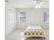 Bedroom featuring a bright ceiling fan, closet space and multiple windows at 2999 Happy Hollow Dr, Conyers, GA 30094
