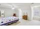 Spacious bedroom features a ceiling fan, antique vanity, and a window seat area at 2999 Happy Hollow Dr, Conyers, GA 30094