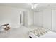 Bedroom featuring a bright ceiling fan, closet space and multiple windows at 2999 Happy Hollow Dr, Conyers, GA 30094