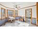 Bright breakfast nook with large windows, ceiling fan, and views to the outdoors at 2999 Happy Hollow Dr, Conyers, GA 30094