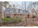 Traditional home with a brick facade, dormer windows, a front porch, and blue shutters at 2999 Happy Hollow Dr, Conyers, GA 30094