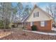 Charming brick home featuring a front porch, dormer windows, and blue shutters at 2999 Happy Hollow Dr, Conyers, GA 30094