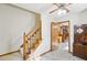 Welcoming foyer featuring a staircase, tiled floor and an open doorway to the dining area at 2999 Happy Hollow Dr, Conyers, GA 30094