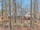 Traditional home with brick and siding exterior, surrounded by trees, offering a serene setting at 2999 Happy Hollow Dr, Conyers, GA 30094