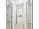 Bright hallway with white walls and views of the connected rooms at 2999 Happy Hollow Dr, Conyers, GA 30094