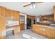 Traditional kitchen with wooden cabinetry, a black refrigerator, and a breakfast bar area at 2999 Happy Hollow Dr, Conyers, GA 30094