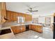 Spacious kitchen has wood cabinets, black appliances, lots of countertop space, and a casual dining area at 2999 Happy Hollow Dr, Conyers, GA 30094