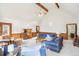 Spacious living room featuring vaulted ceilings, wood trim and comfortable seating arrangements at 2999 Happy Hollow Dr, Conyers, GA 30094