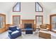 Comfortable living room with vaulted ceilings, a brick fireplace, and an abundance of natural light at 2999 Happy Hollow Dr, Conyers, GA 30094