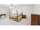 Spacious main bedroom features a four-poster bed and multiple dressers at 2999 Happy Hollow Dr, Conyers, GA 30094