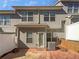 Townhouse backyard with wood fence, patio and exterior door to the home at 3194 Haynes Park Dr, Lithonia, GA 30038