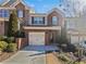 Charming brick townhome with a one-car garage and manicured landscaping at 3194 Haynes Park Dr, Lithonia, GA 30038
