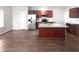 Well-equipped kitchen with stainless steel appliances and wood cabinets at 3194 Haynes Park Dr, Lithonia, GA 30038