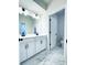 Bathroom featuring double vanity with modern fixtures and an open doorway at 718 Crossroad Ct, Powder Springs, GA 30127