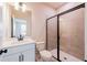 Well-lit bathroom with a modern vanity, toilet, and sleek glass-enclosed shower at 718 Crossroad Ct, Powder Springs, GA 30127