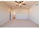 A bedroom with a ceiling fan, carpet, and two windows at 718 Crossroad Ct, Powder Springs, GA 30127