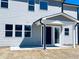 Exterior of the house with a covered patio and sliding glass doors at 718 Crossroad Ct, Powder Springs, GA 30127