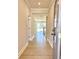 Inviting hallway with wood floors leading to an open living space with natural light at 718 Crossroad Ct, Powder Springs, GA 30127