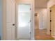 Hallway showcasing open doorways that lead to rooms with carpet or hard wood flooring at 718 Crossroad Ct, Powder Springs, GA 30127