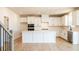 Bright kitchen with white cabinets, a kitchen island, stainless steel appliances, and a walk in pantry at 718 Crossroad Ct, Powder Springs, GA 30127