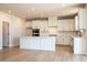 Bright kitchen features an island, modern appliances, and ample cabinet space at 718 Crossroad Ct, Powder Springs, GA 30127