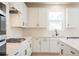 Modern kitchen with white cabinets, stainless steel appliances and natural light at 718 Crossroad Ct, Powder Springs, GA 30127