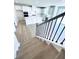 Staircase view into modern kitchen with large island and stainless steel appliances at 718 Crossroad Ct, Powder Springs, GA 30127