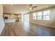 Open-concept living area with a modern kitchen, hardwood flooring and lots of sunlight at 718 Crossroad Ct, Powder Springs, GA 30127