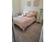 Cozy bedroom with soft pink bedding and a decorative mannequin at 104 Worthy Drive, Mcdonough, GA 30252