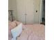 Comfortable bedroom with soft pink bedding and a double-door closet at 104 Worthy Drive, Mcdonough, GA 30252