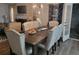 Well-lit dining room featuring a stylish chandelier, dining table, and modern flooring at 104 Worthy Drive, Mcdonough, GA 30252