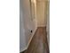 Hallway with wood-look flooring and modern wall decor at 104 Worthy Drive, Mcdonough, GA 30252