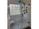 Modern shower with marble tile and glass enclosure at 104 Worthy Drive, Mcdonough, GA 30252