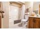 Bright bathroom with a shower-tub combination and modern white toilet at 1824 Colonial South Sw Dr, Conyers, GA 30094