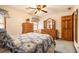 Bedroom with blue and white bedding and natural wood furniture at 1824 Colonial South Sw Dr, Conyers, GA 30094