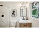 Bathroom with a granite countertop, flower picture, and marble tile at 2210 Bolling Brook Sw Dr, Atlanta, GA 30311