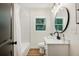 Modern bathroom featuring subway tiles, a vanity, and a shower/tub at 2210 Bolling Brook Sw Dr, Atlanta, GA 30311