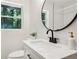 This bathroom contains a view of nature from the window at 2210 Bolling Brook Sw Dr, Atlanta, GA 30311