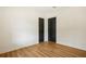 This is a bedroom with two doors and light hardwood floors at 2210 Bolling Brook Sw Dr, Atlanta, GA 30311