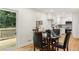 View of a dining room and a kitchen with door to the backyard deck at 2210 Bolling Brook Sw Dr, Atlanta, GA 30311