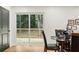 Comfortable dining room with a door to the outdoor deck and a view of the back yard at 2210 Bolling Brook Sw Dr, Atlanta, GA 30311