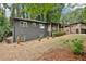 Side view of an updated home featuring a painted brick exterior and covered porch at 2210 Bolling Brook Sw Dr, Atlanta, GA 30311