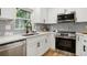 Stylish kitchen with a stainless steel oven, undermount sink, and new appliances at 2210 Bolling Brook Sw Dr, Atlanta, GA 30311