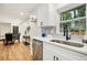 Well-lit kitchen with new stainless-steel appliances and stone countertops at 2210 Bolling Brook Sw Dr, Atlanta, GA 30311