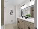 Updated bathroom with quartz counters, modern fixtures, and a framed mirror at 2385 Tiffany Pl, Decatur, GA 30035