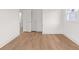 Empty bedroom featuring light wood floors, white walls and trim at 2385 Tiffany Pl, Decatur, GA 30035