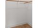 Empty closet featuring minimalist design with wooden hanging rods and trim at 2385 Tiffany Pl, Decatur, GA 30035