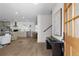 Open-concept entryway flows into a modern kitchen with stainless steel appliances and light wood floors at 2385 Tiffany Pl, Decatur, GA 30035