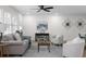 Living room with light wood floors, neutral walls, modern decor, and a ceiling fan at 2385 Tiffany Pl, Decatur, GA 30035